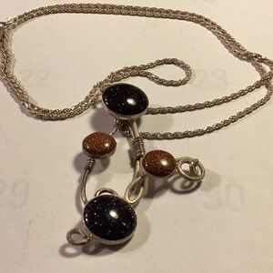 Women’s black and gold sunstone necklace